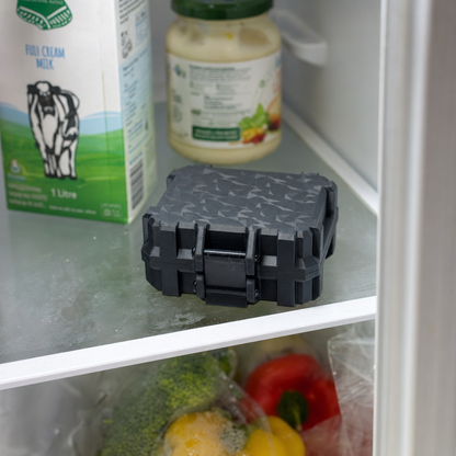 10-slot peptide vial case with BAC water bottle holder — black, in fridge